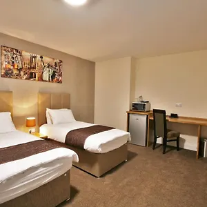 Отель New County & Serviced By Roomsbooked